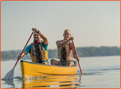 two people rowing in canoe
