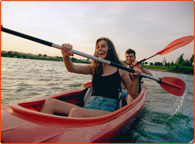 two people rowing in kayak