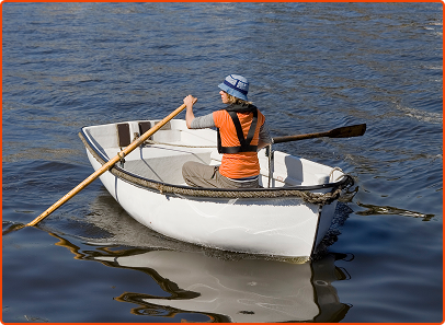 person rowing in row boat